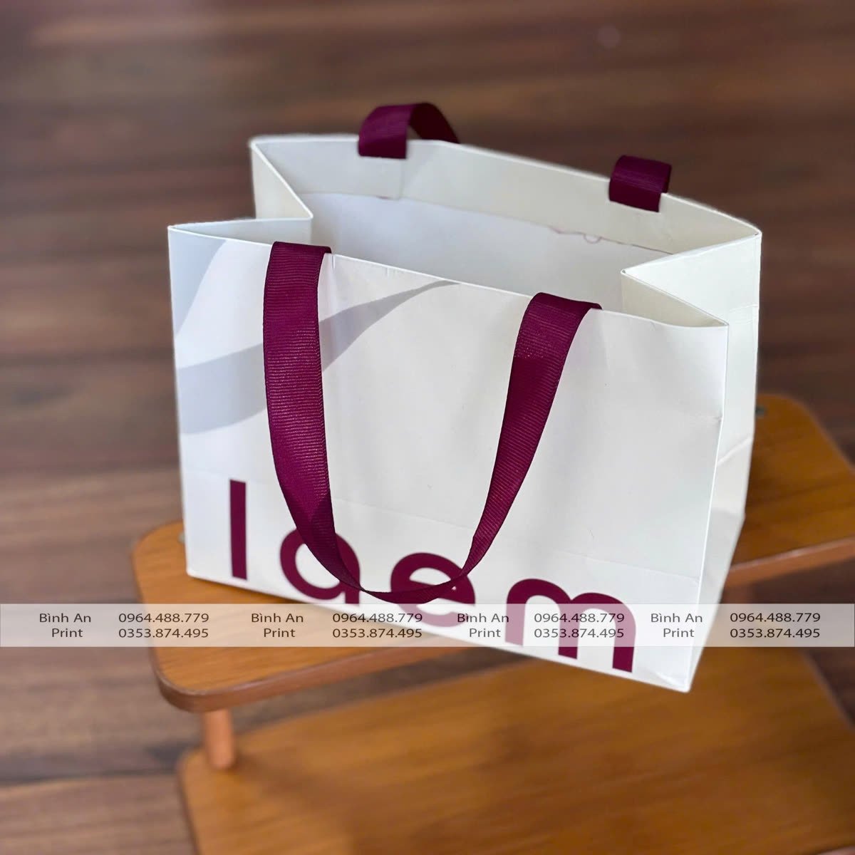 Túi giấy làem, Ivory 230gsm, cán mờ, quai dây lụa dán, do In Bình An in
